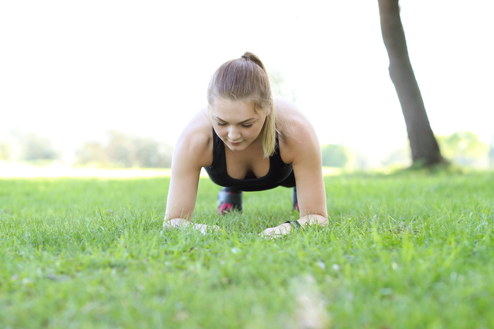 Picture of woman performing a plank to build core strength