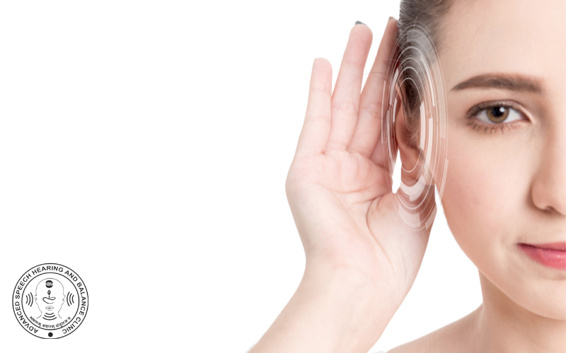 Woman receiving audiology treatment, holding ear to head.