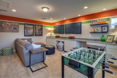 bonus room ideas for your basement remodel game area with televisions and sofa custom built michigan