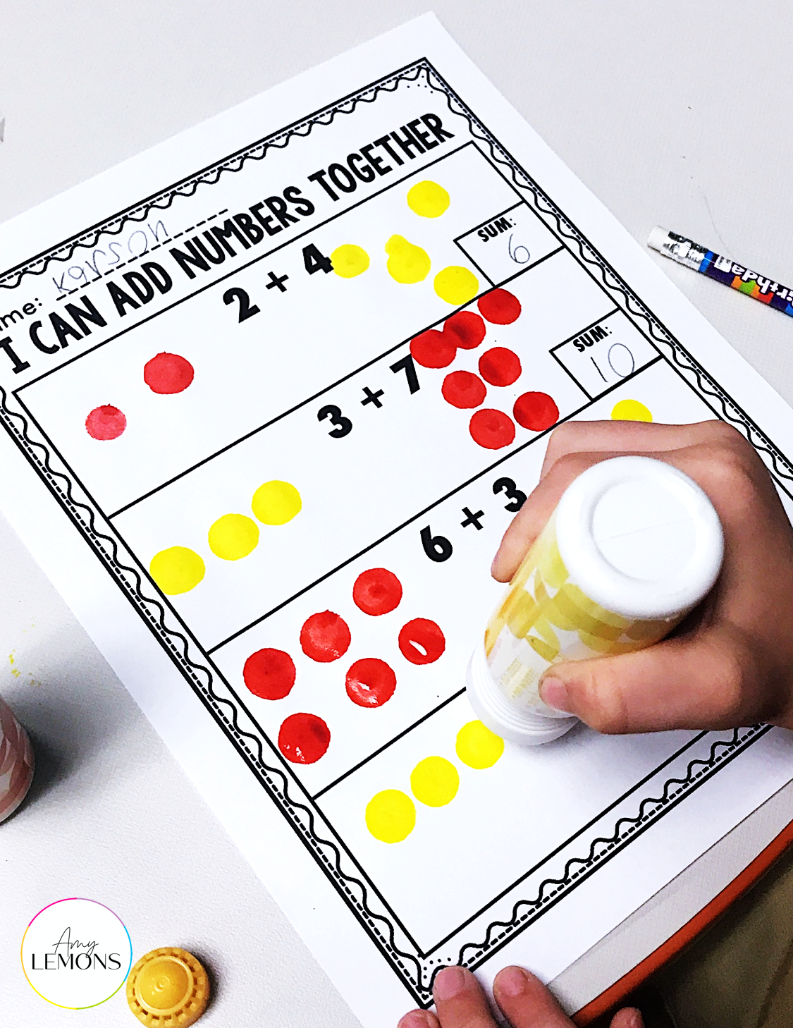 Solving equations printable with paint dot markers for modeling addends.