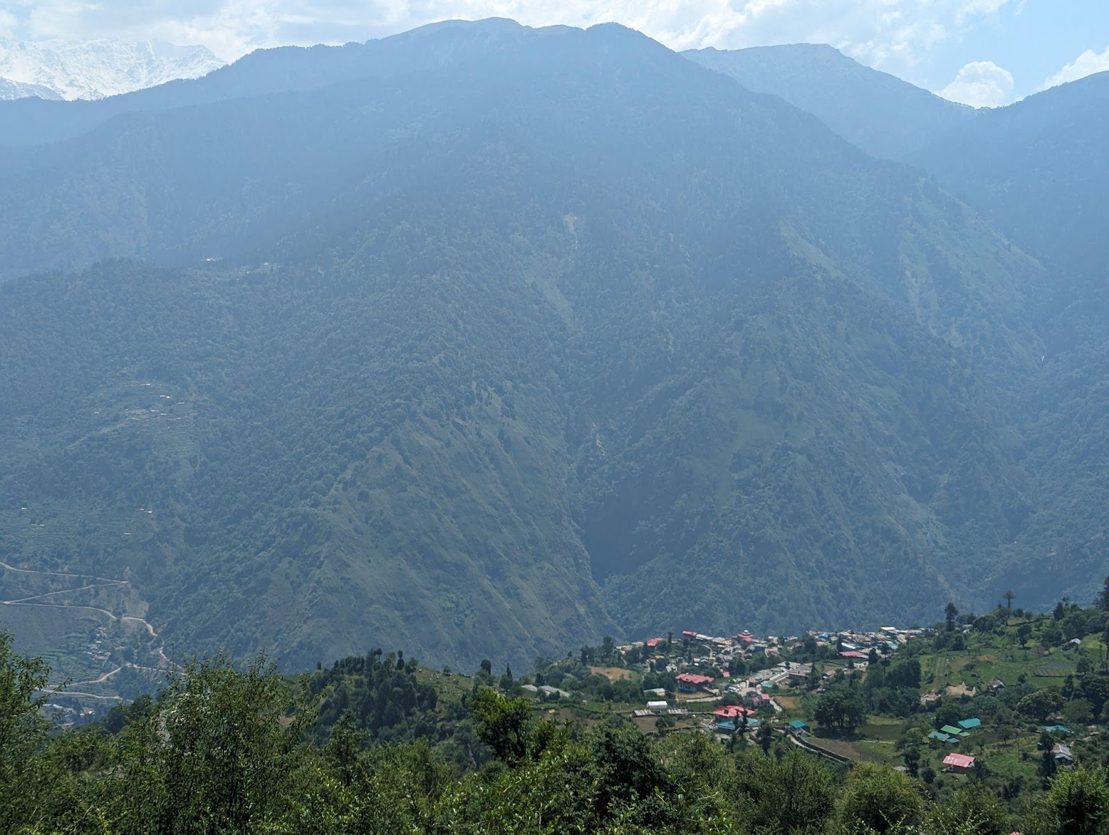 descending from dayara bugyal trek towards the raithal village