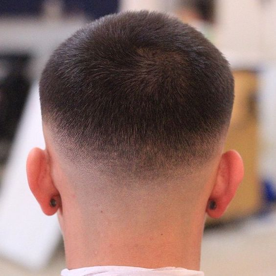 Back view of a guy wearing the Mid Fade Buzz Cut