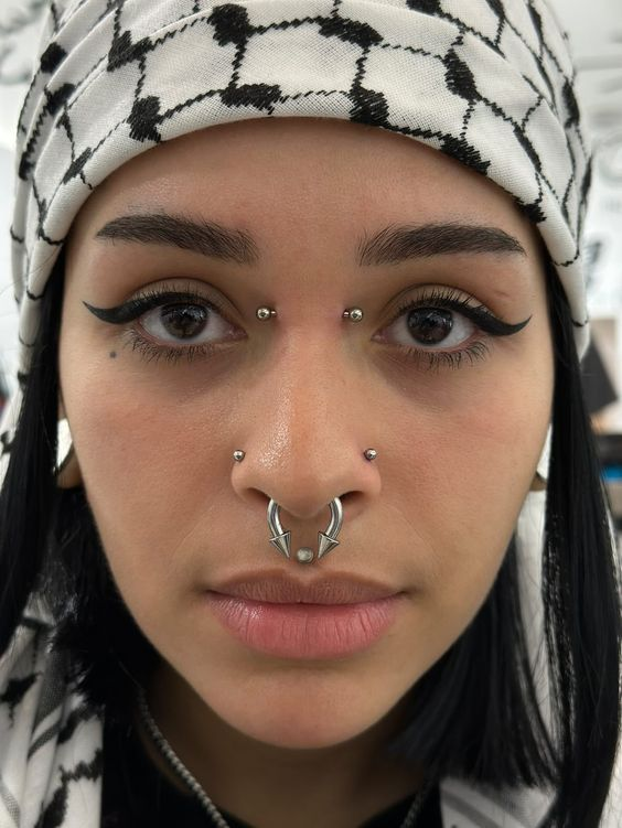 Full view of a girl wearing the Bridge  piercing