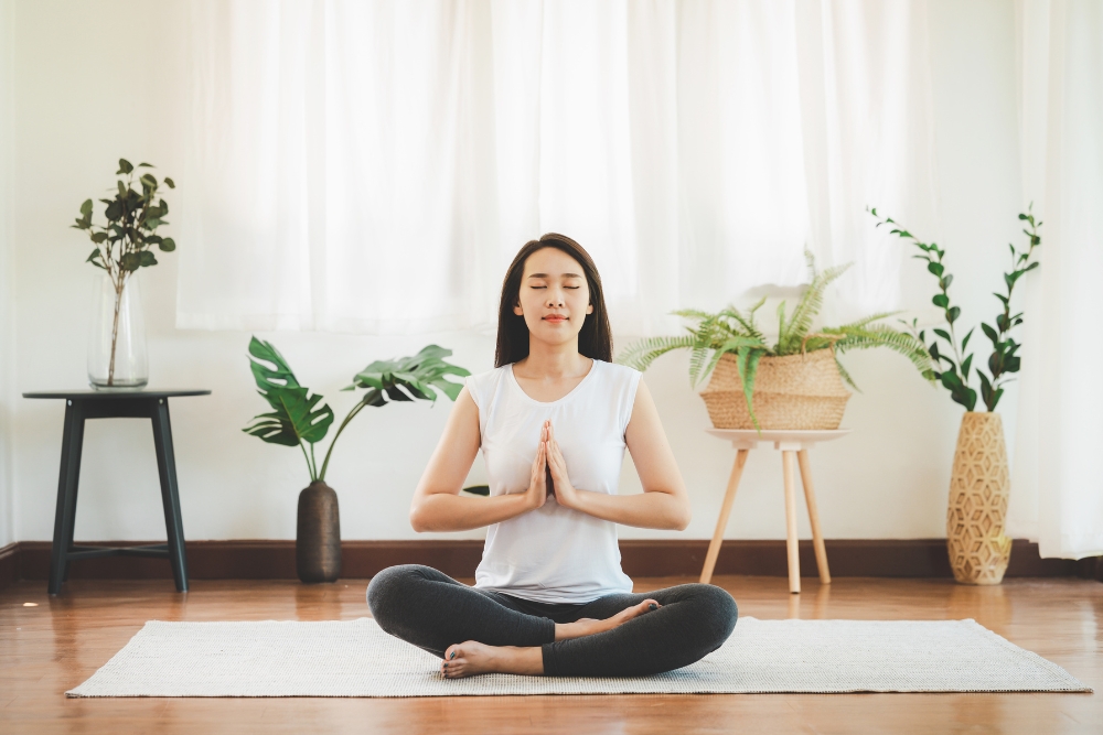 Women performing Zen Meditation at home.