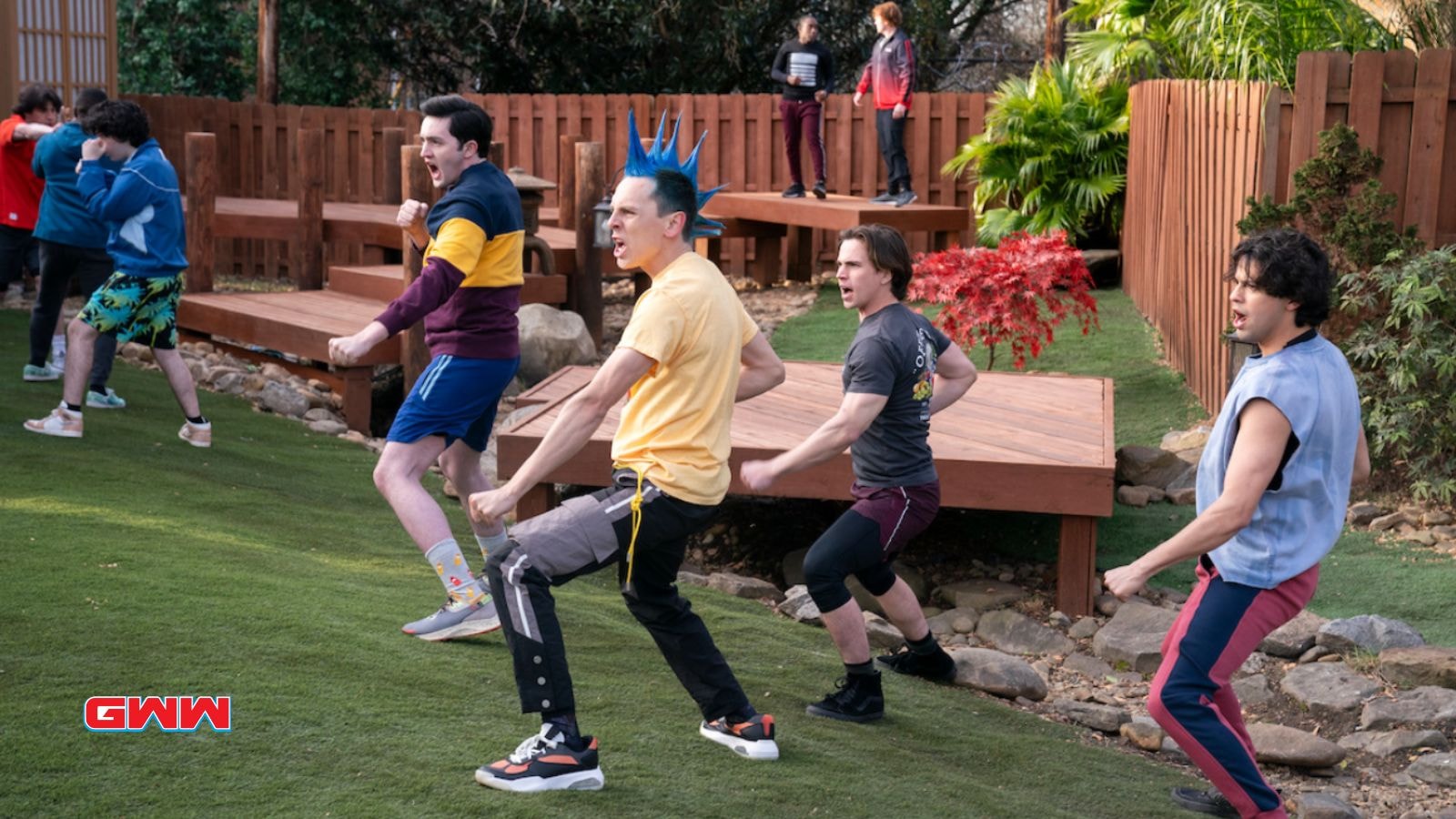 Teenage boys practicing karate poses outdoors, Cobra Kai Season 6 Trailer 