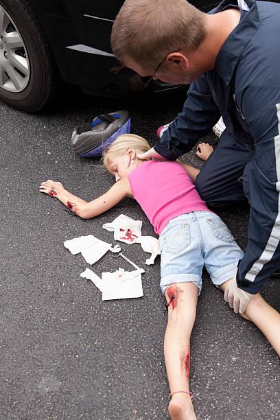 Litle Girl Hit by car Series Little girl after she has been hit by a car while riding a bikeCheck out my Tragedy Series Death of a child stock pictures, royalty-free photos & images