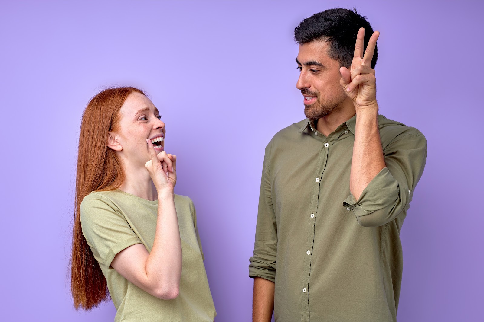 two people communicating in sign language 