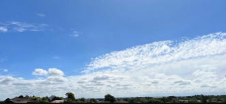 Blue sky many cumulus clouds