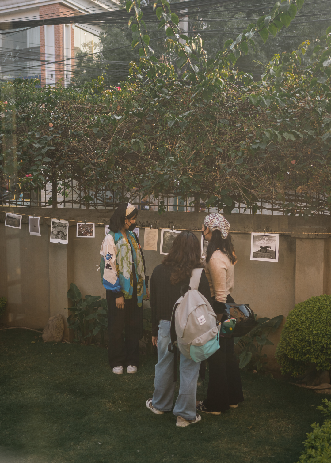 Three people stand in front of a display of photographs and information at Nature's Market, discussing the importance of sustainable choices and community action in combating climate change.
As we face the challenges of climate change, events like Nature's Market remind us that we're not powerless. Every choice we make—from the clothes we wear to the art we create—can be a step towards a more sustainable world.