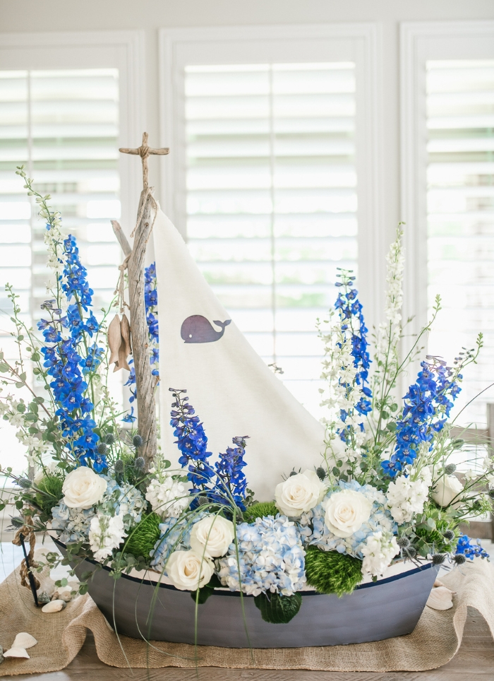 boat centerpiece with blue and white flowers