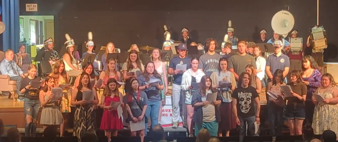 image of Mr. Ledwith and music students and alumni at a music banquet