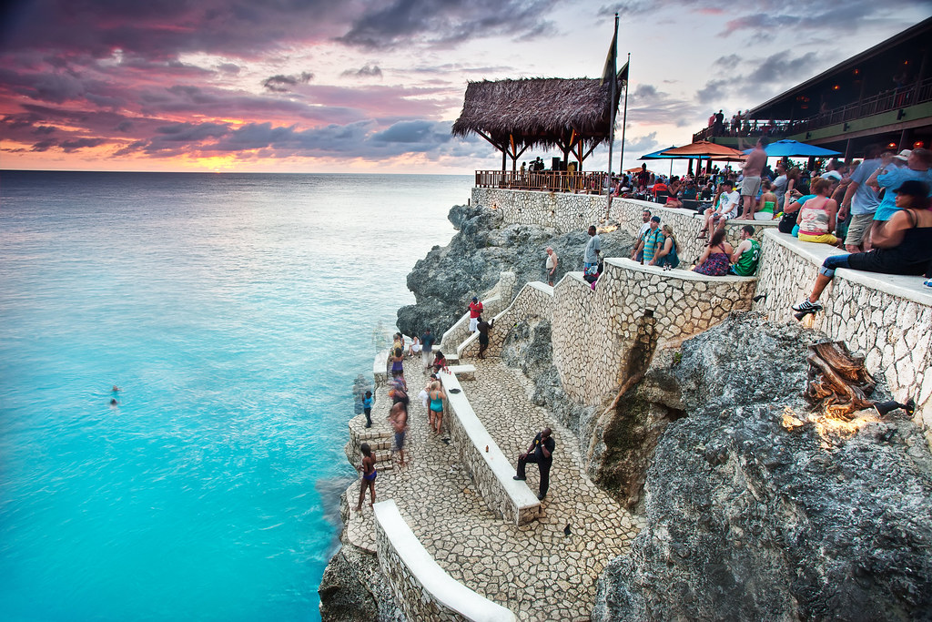 People adoring perfect sunset in Jamaica
