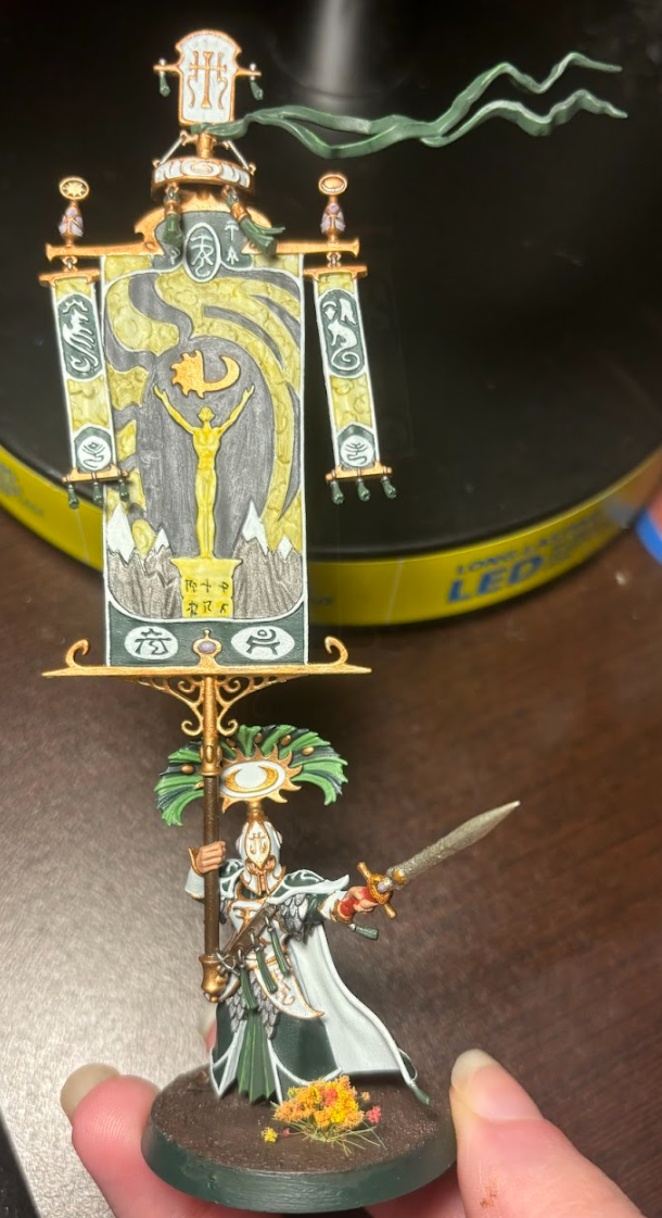 A toy figurine of a warrior holding a sword Description automatically generated