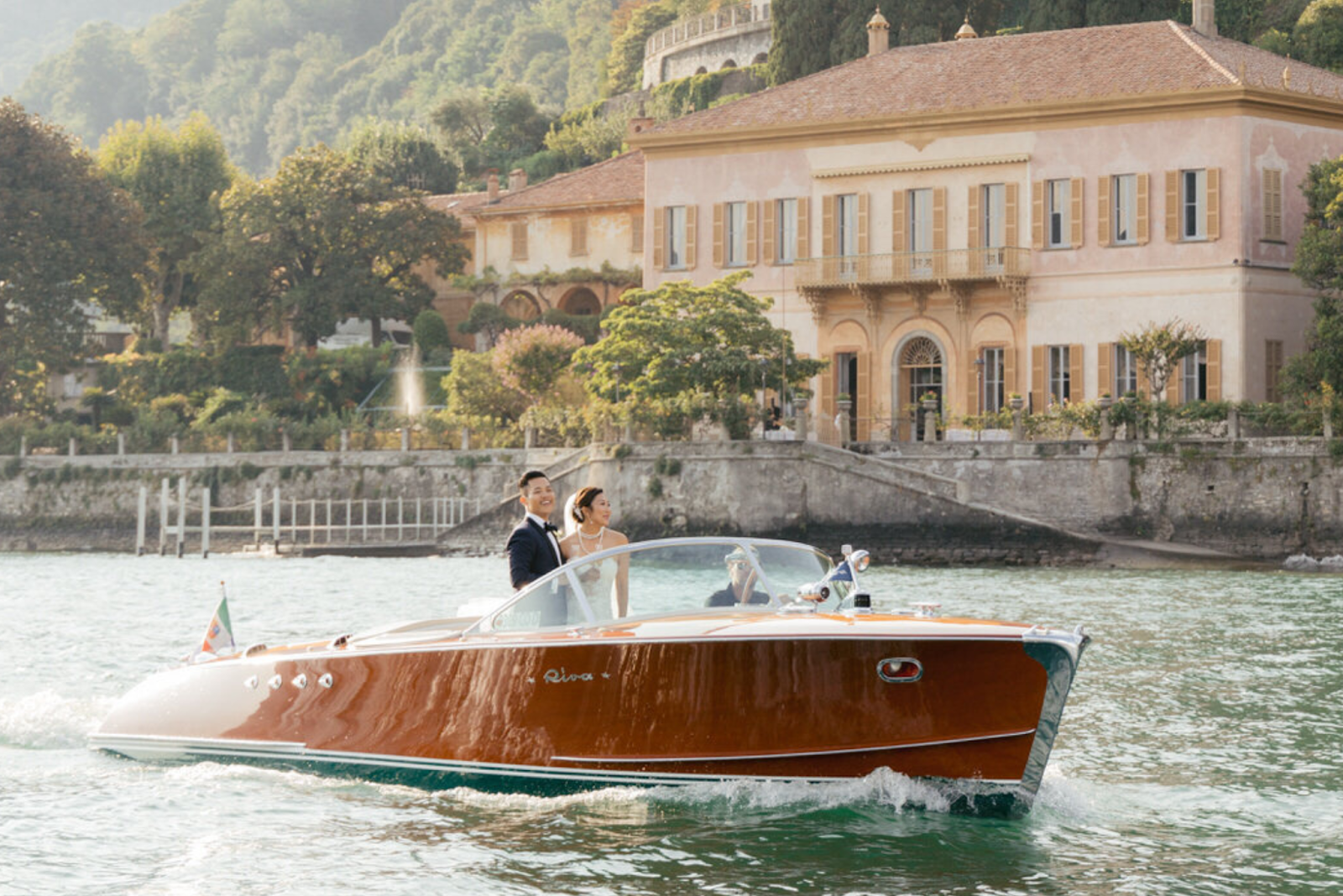 Newlyweds enjoying their Tinggly's wedding experience gift on the boat tour in Italy