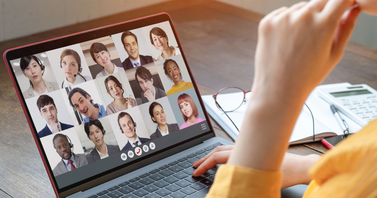 a woman working remotely and communicating with her team through laptop