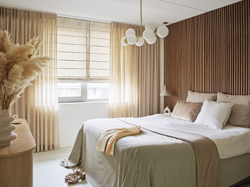 Beige drapery in a bedroom