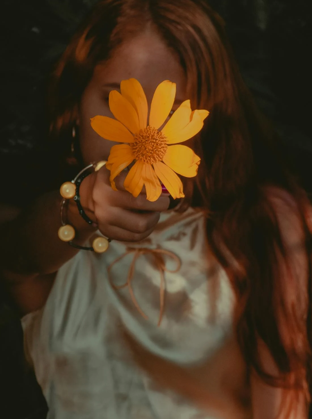 Aesthetic DP for Girls holding a flower