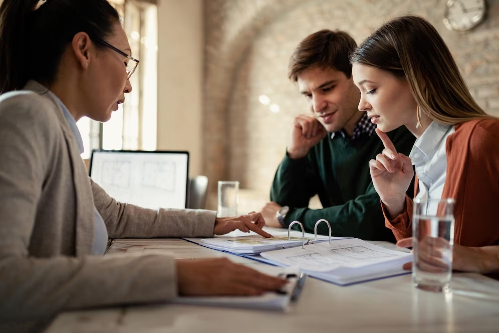 (couple reviewing information provided by an attorney)