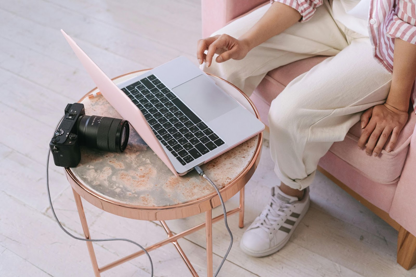  a person at a laptop with a camera