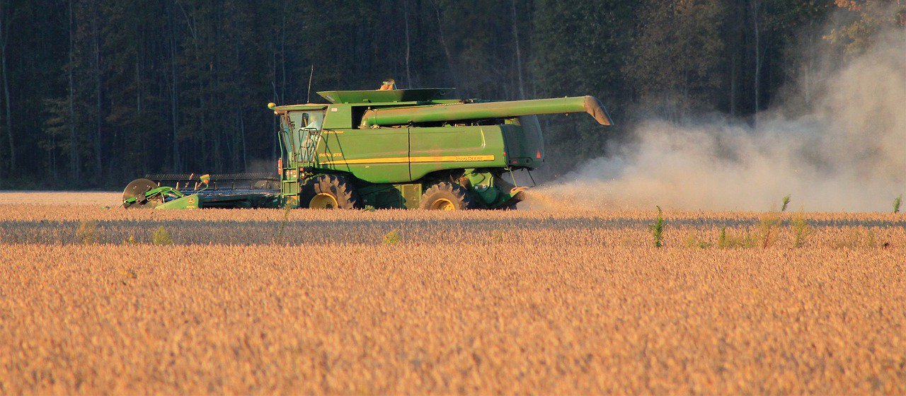 Truck mowing a field