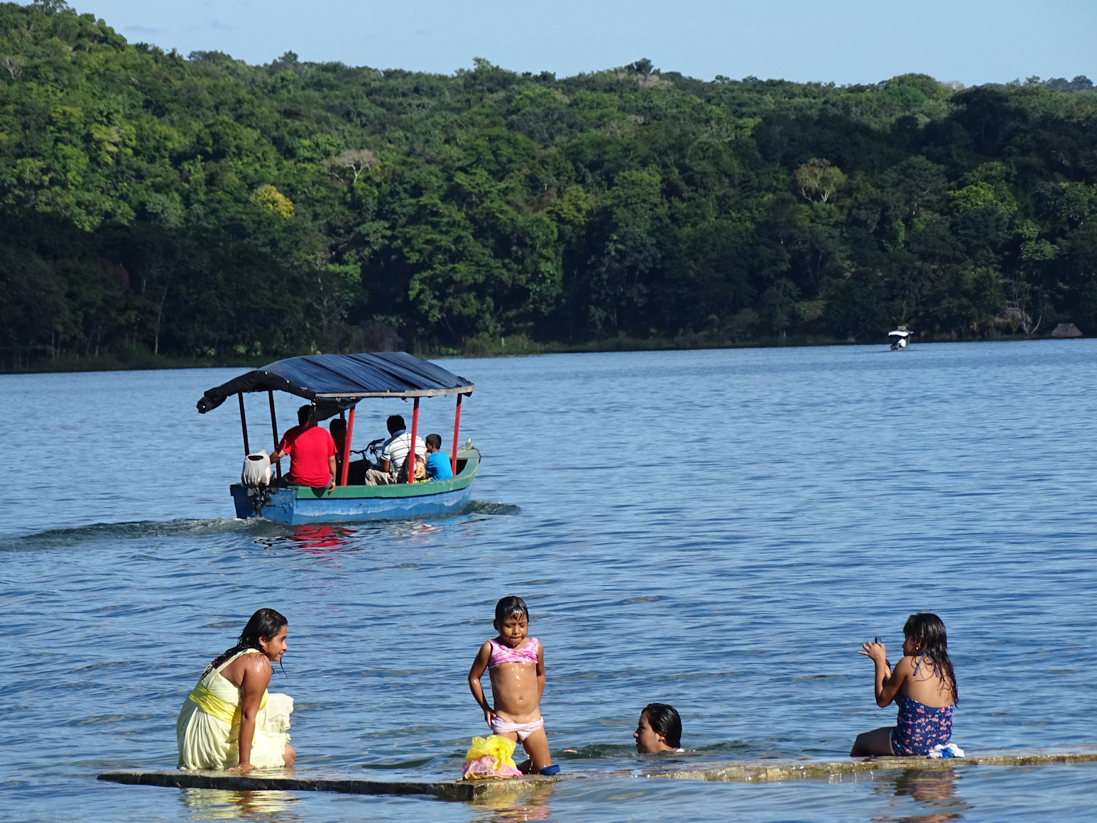 children swimming in Lake Petén Itzá.