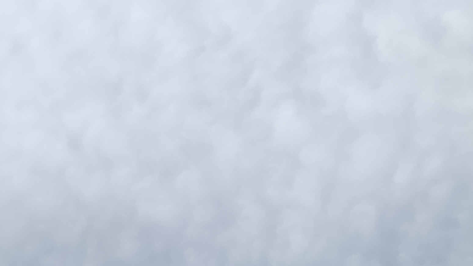 A wooly layer of vaguely blue-tinted clouds