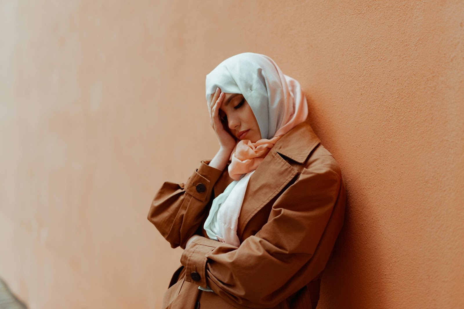 Alone Sad Hijab Woman in a brown jacket