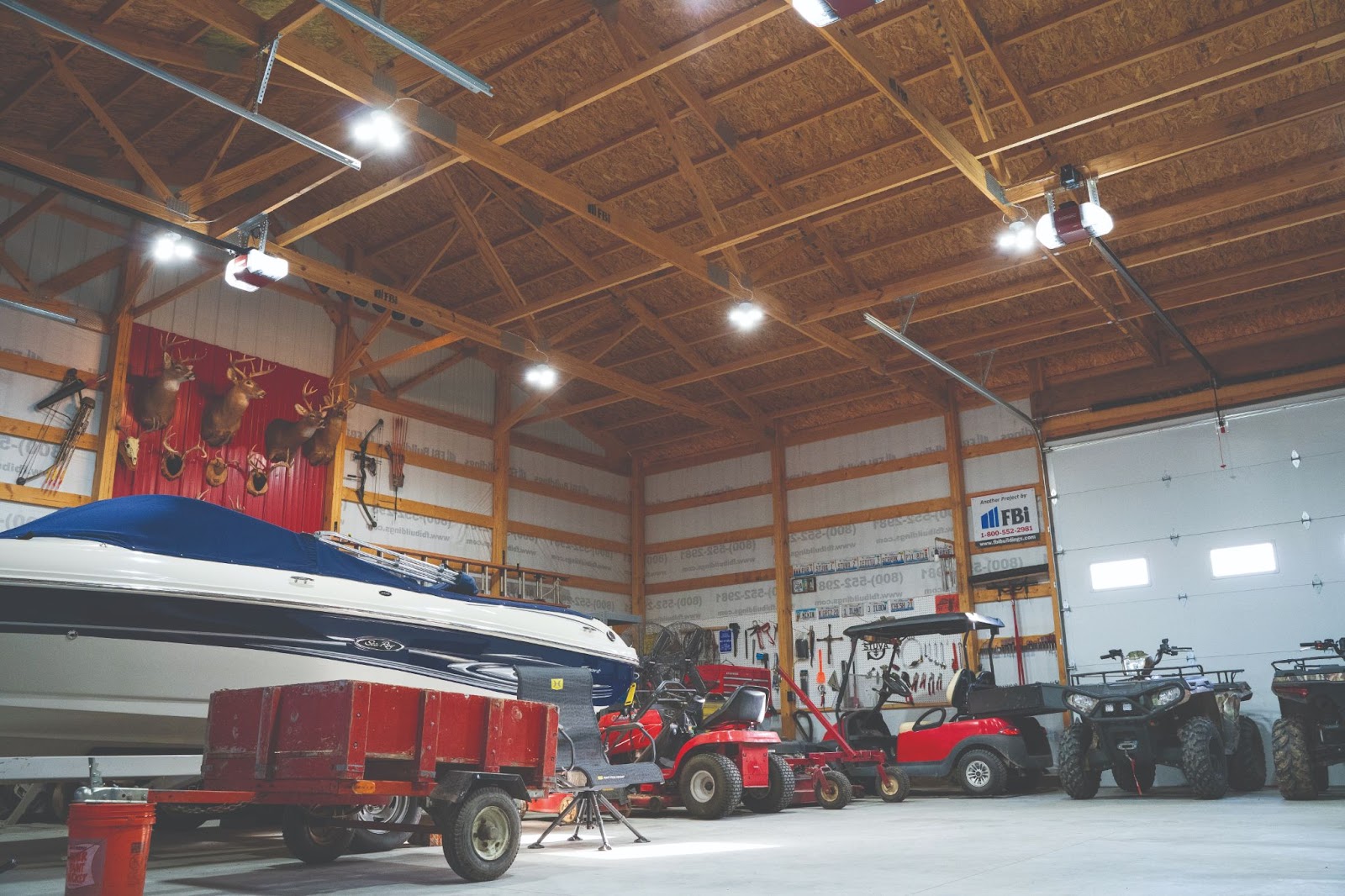 boat and golf cart inside a man cave garage