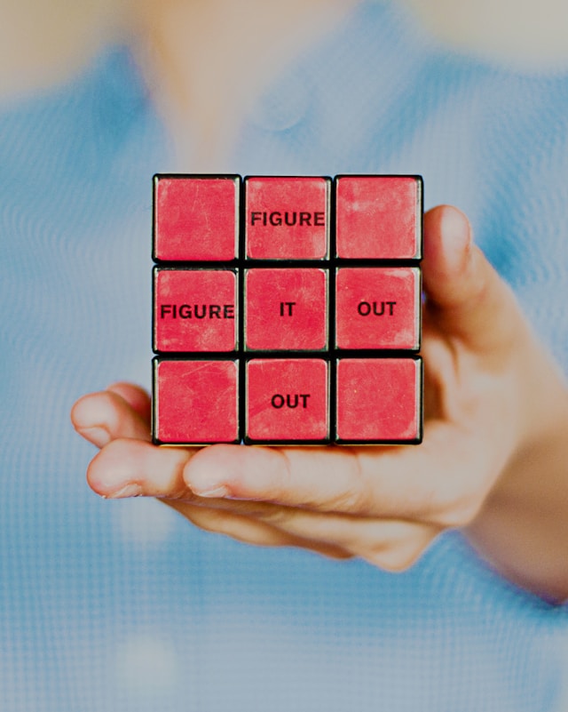 A rubik's cube with the word "figure it out".