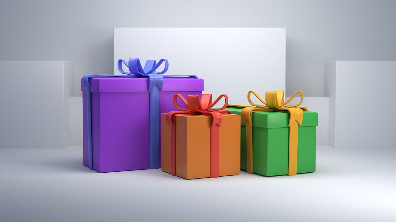 Three gifts in front of a white background