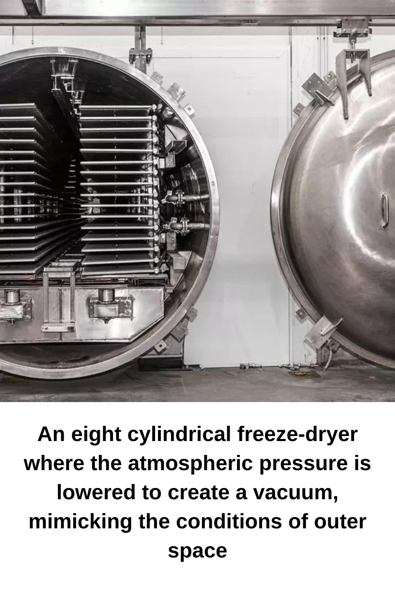 An 8 cylindrical freeze-dryer where the atmospheric pressure is lowered to create a vacuum, mimicking the conditions of outer space