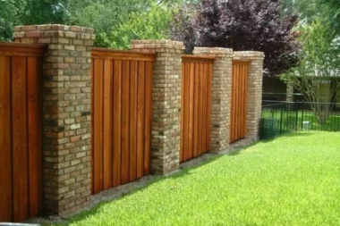comparing common fencing materials masonry fence with bricks custom built michigan
