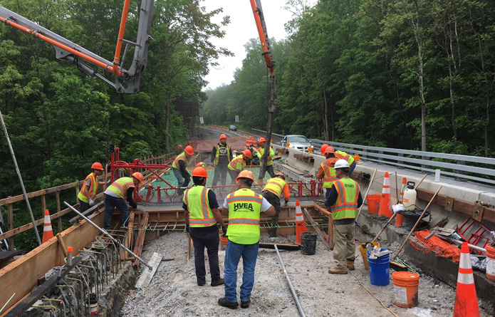 View of the construction workers working on the road