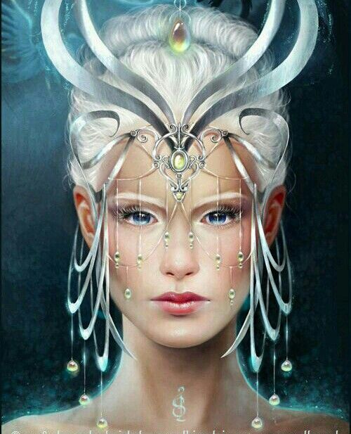 Goddess Caer has her white hair pulled up with a headdress. It is adorned with many jewels. 