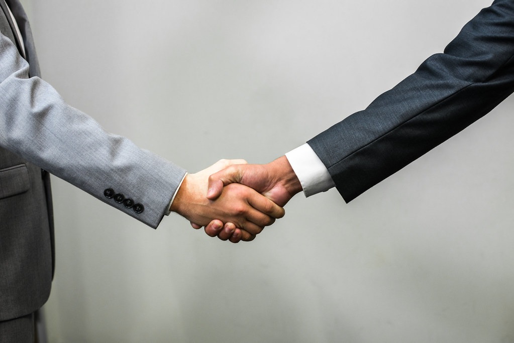 two men shaking hands