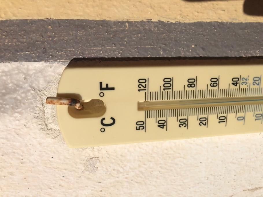 A thermometer on a wall

Description automatically generated