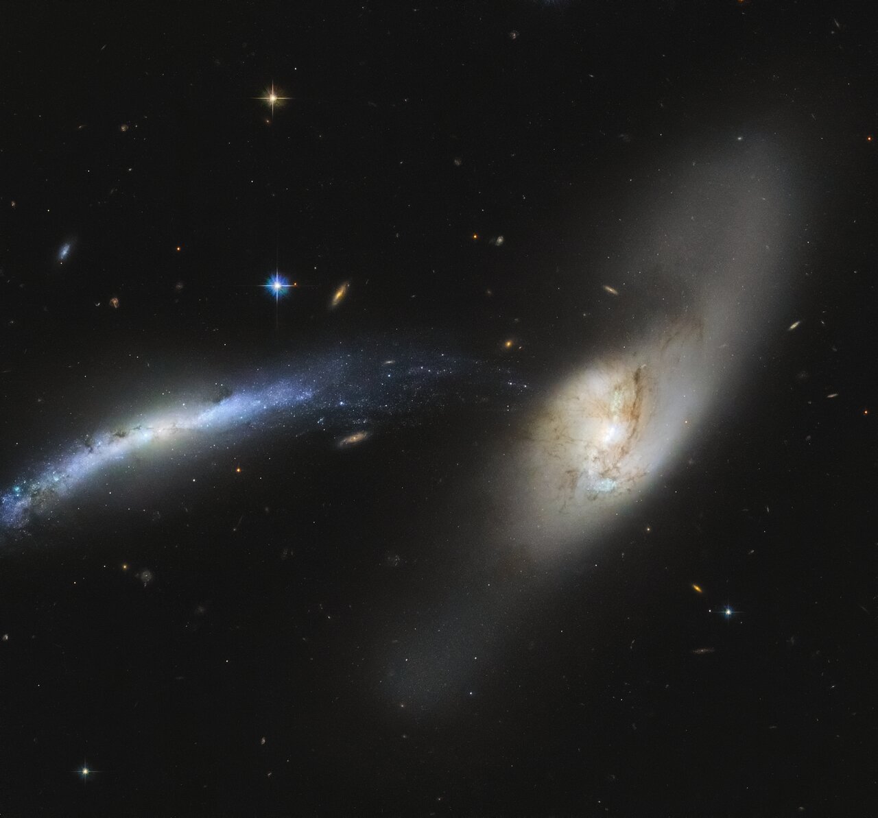 Galactic mergers can take hundreds of millions to a billion years to complete and form a single irregular entity