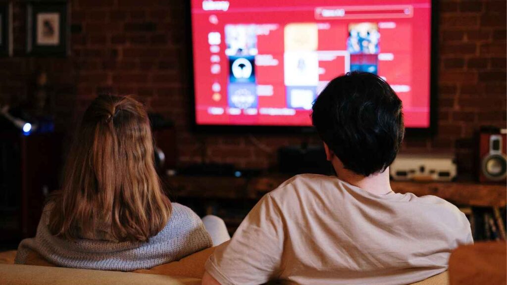 Couple watching tv together