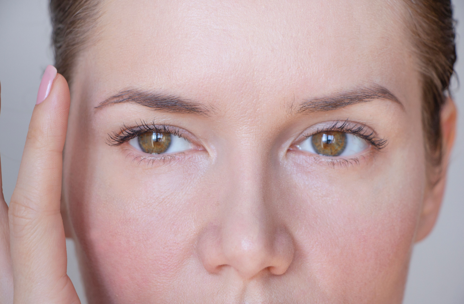 A close-up image of a woman's face and eyes