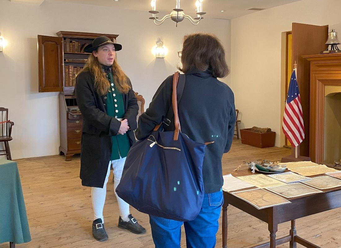 Historic interpreter Blaise Glowiak answers questions from New Castle Court House Museum visitors.