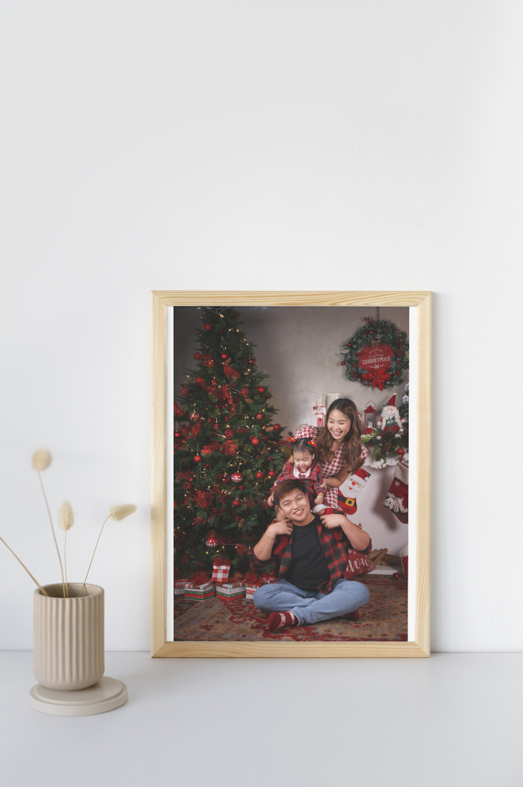 picture frame of christmas family picture wearing one of our Family Christmas Photo Outfit Ideas