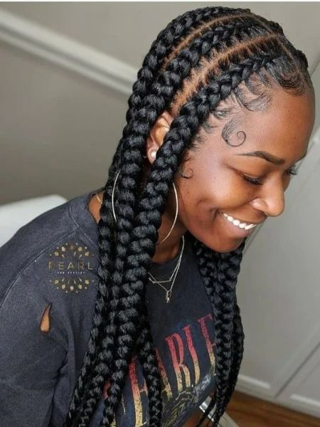 Full picture showing a lady rocking the braids with class
