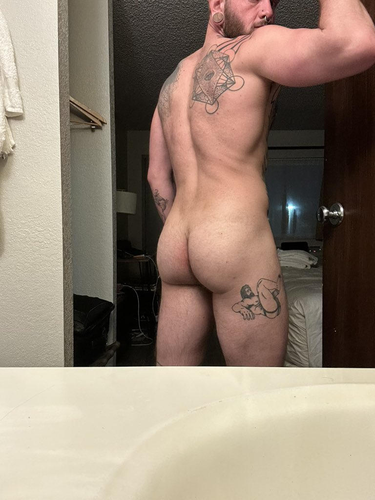 Logan Loads naked showing off his thigh tattoos and back tattoos and hairy gay bubble butt