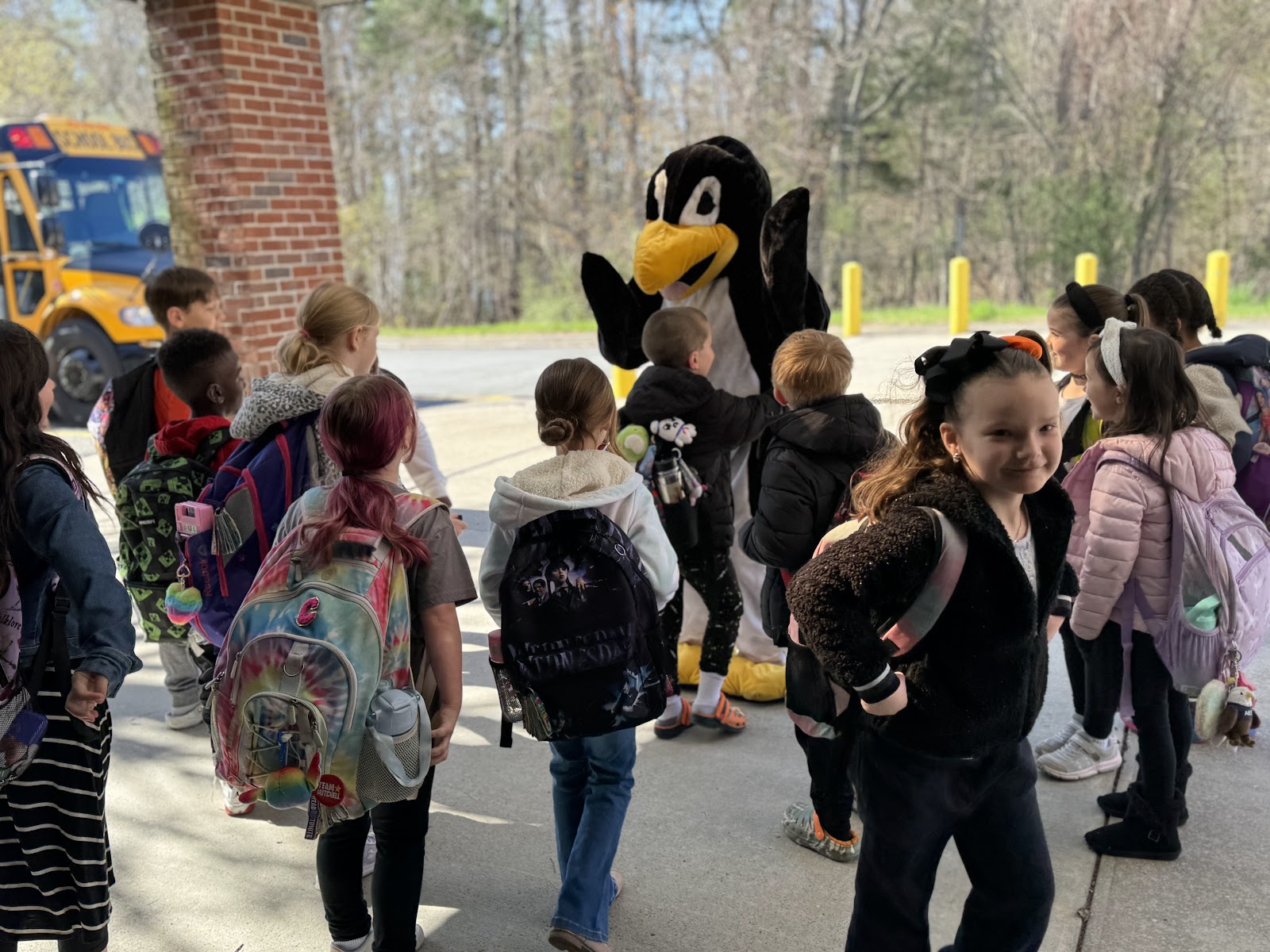 image of students with Jiji the penguin