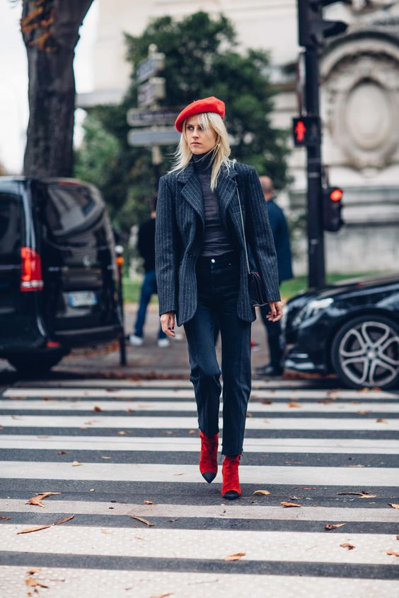 Turtlenecks, jeans, and red boots are worn in fall and winter