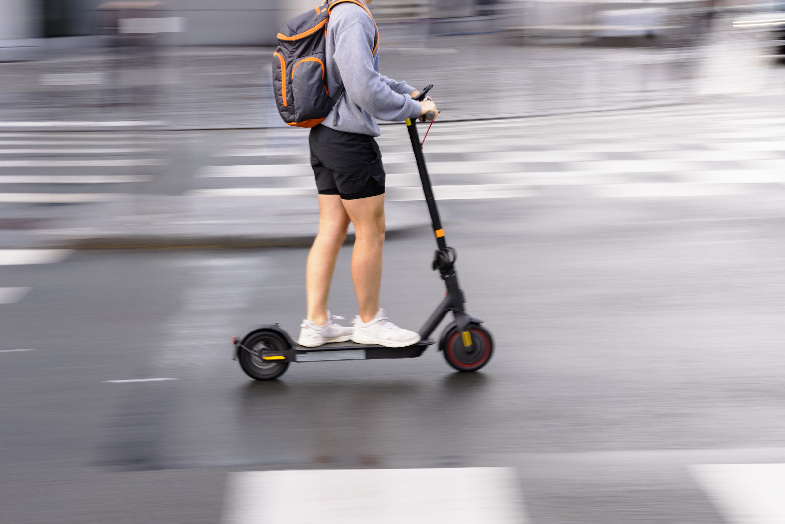 electric scooter injuries in tampa florida, man riding quickly through the street