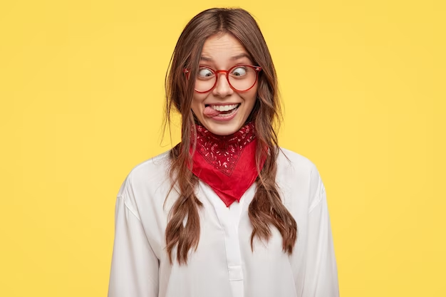 a woman making eyes crossed and sticking her tongue out