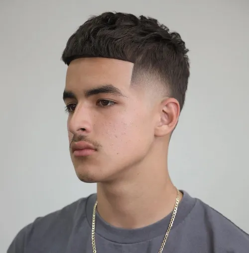 Full picture of a guy rocking a neat edges fade haircut