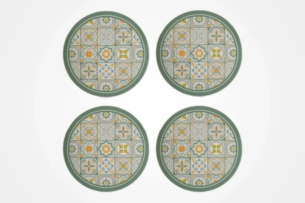 Set of four round table mats with a mosaic tile design in green and yellow tones