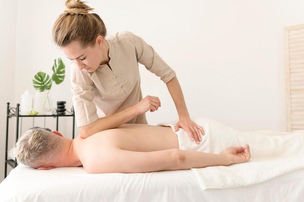 Woman massaging man